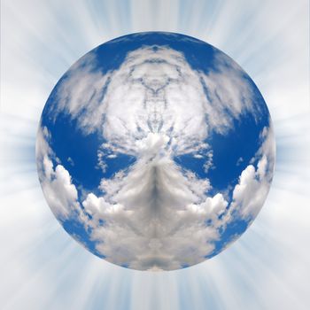 Vew of puffy clouds in blue sky in shape of globe