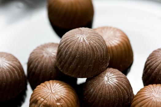 chocolate candies on abstract background