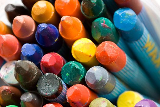 a variety of differrent color old wax crayons