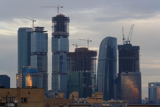 sunrise in Moscow, view of a large office complex under construction