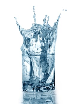 Glass of splashing water with ice. Isolated on white with clipping path