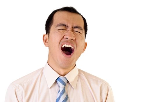 Tired businessman yawning with funny expression on white background.