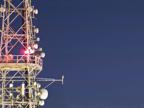Detail of mobile phone service antenna at night