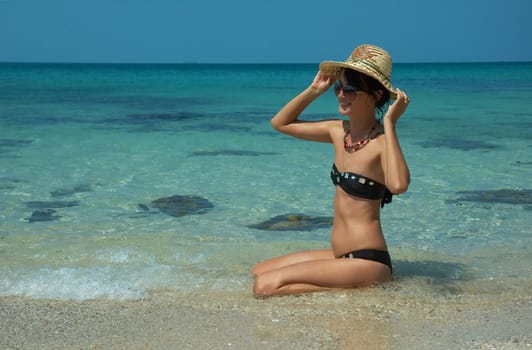 Beautiful women on the beach. Relaxing landscape.