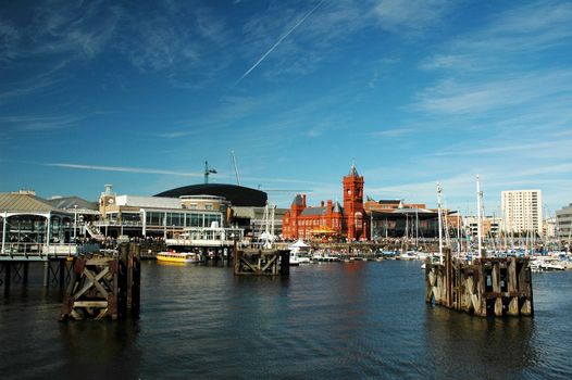 cardiff bay with red historical building in very summer nice day with blue sky covered by clouds