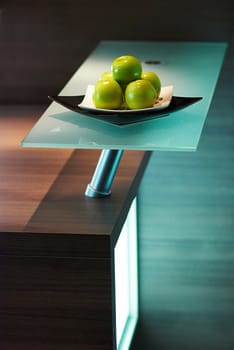 Granny smith apples on table in modern kitchen