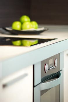 Granny smith apples on table in modern kitchen