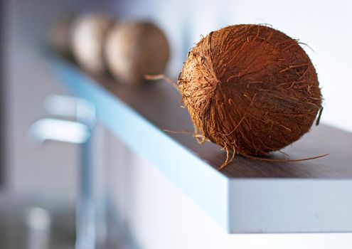 Brown coconuts on modern white kitchen