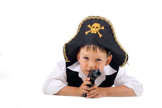 Lying pirate boy on isolated white background