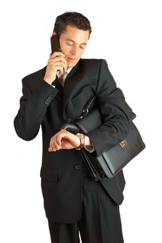 Businessman with cellphone and briefcase. Isolated on white.