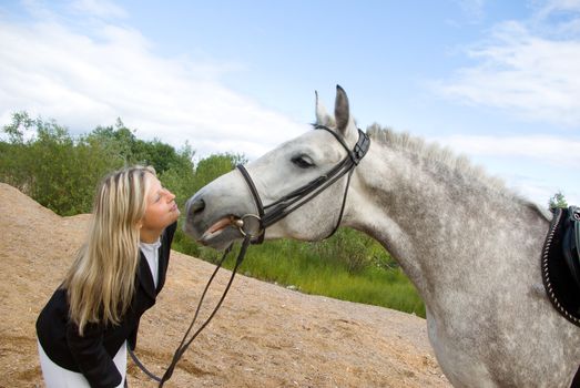 girl with horse.Friendship of an animal and the person