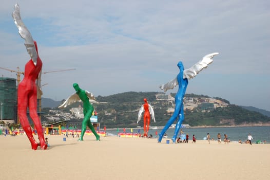 South China Sea, beach at DaMeiSha near Shenzhen city in Guangdong province. Place decorated by big angels sculptures.