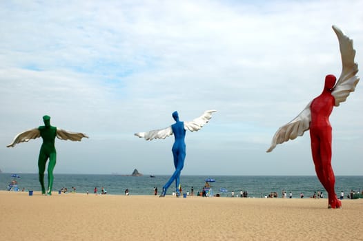 South China Sea, beach at DaMeiSha near Shenzhen city in Guangdong province. Place decorated by big angels sculptures.