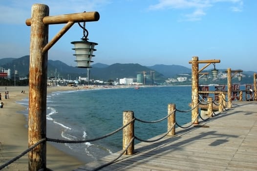 South China Sea, wooden pier at beach near Shenzhen city in Guangdong province.