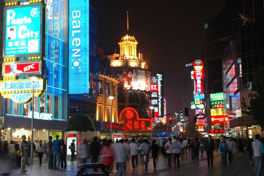 CHINA, SHANGHAI, NANJING ROAD - MAY 12, 2007: shopping paradise in China, famous Nanjing Lu with thousands of shops, neon lights, crowd of people.