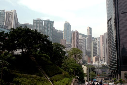 Hongkong, Central residential area with highest buildings surrounded by hills.