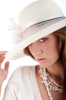 Isolated young pretty woman in a white hat