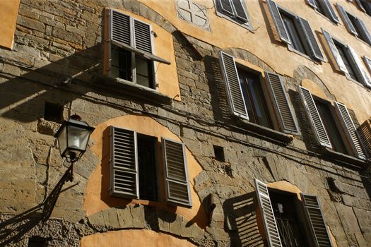 A street in Florence, Italy late in the day as the sun goes down.
