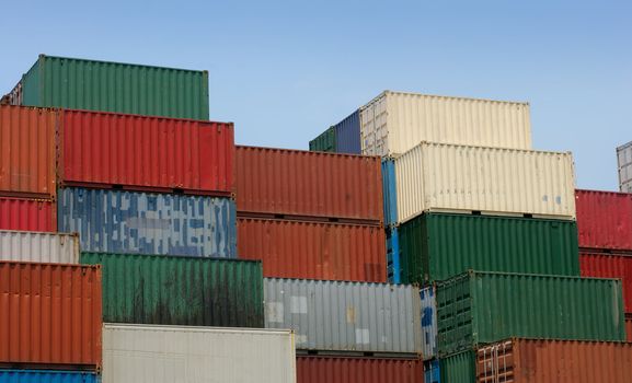 Shipping containers waiting to be loaded on a cargo ship.  