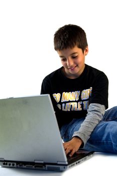 young boy studying on a notebook