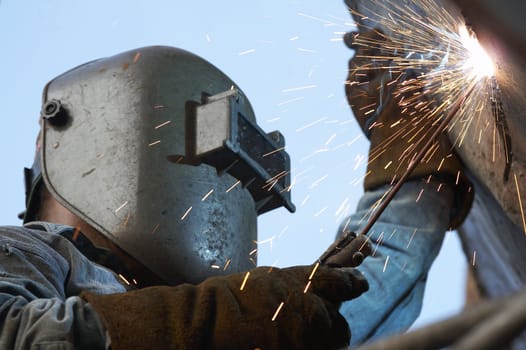 a metal welder busy at work
