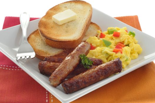 Delicious breakfast of eggs, sausage and toast.
