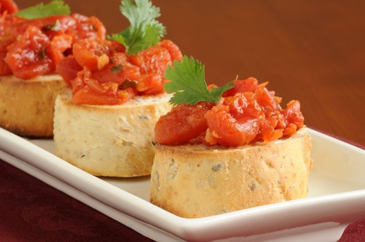 Colorful homemade delicious toasted bruschetta on a plate.