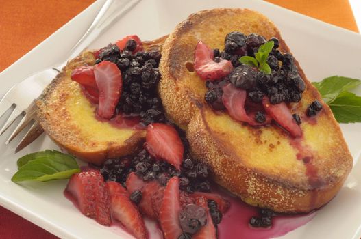 Delicious french toast topped with seasonal berries.