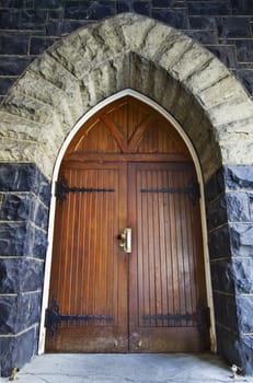 Antique Wooden Door in Old Historic Stone Building