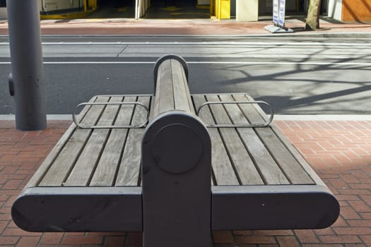 Public Park Wood Bench in City Downtown