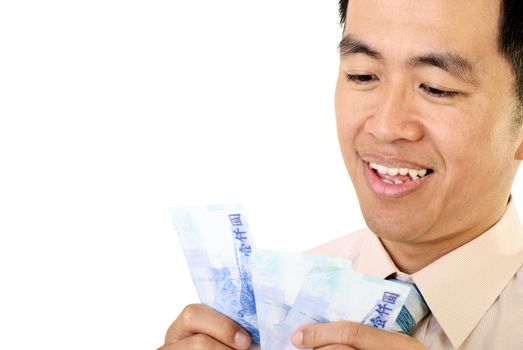 Businessman of Asian count money of Taiwan bill on white background.