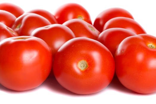 close-up many tomatoes, isolated on white