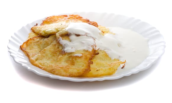 close-up pancake from marrow and lure on plate, isolated over white background