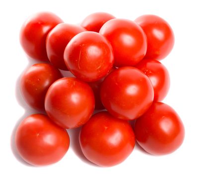 close-up tomatoes in pyramid, view from above, isolated on white