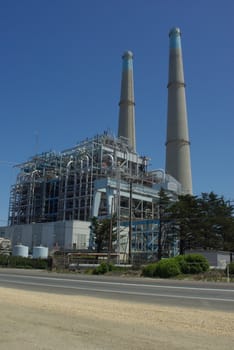 A electrical generation plant with 2 large steam stacks creates poewer for the local community