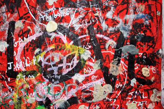 Grafitti on a wall, Love written with black over red, chewing gum names and all sort of grunge detail.