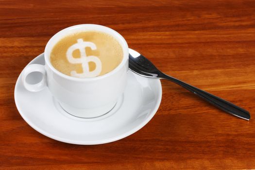 Cup of double shot cappuchino with dollar sign made with frothing milk in the coffee foam, The froth of the dollar sign is not very detailed with bubbles etc due to manipulation in creating the sign