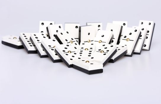 dominos falling over, concept of cause and effect