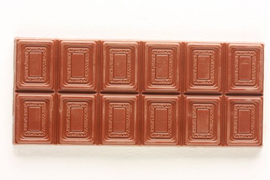 Milk chocolate bar isolated on white, shot in studio