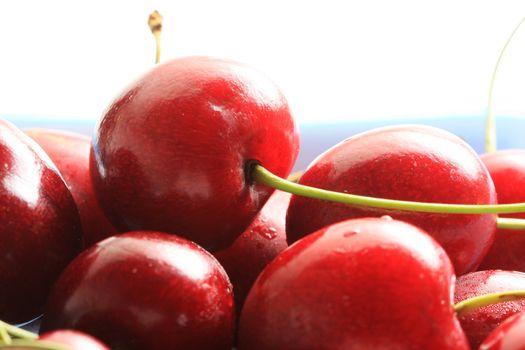 fresh red cherries in a bowl, high key lighting