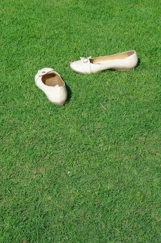 White shoes on green grass                               