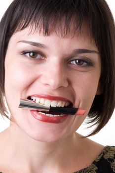 Beautiful woman with lipstick in her teeth close up.