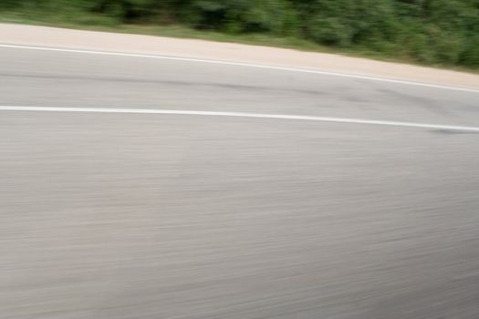 Snapshot of asphalt made from a car heading at high speed