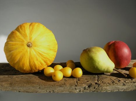 many yellow fruits  - some plums and melon