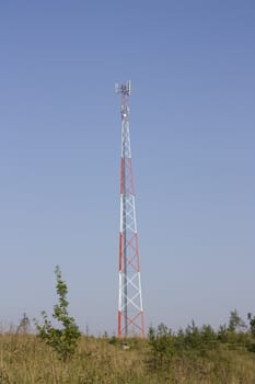 Tower of cellular communication on a background of the blue sky