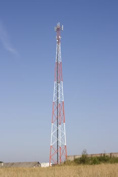 Tower of cellular communication on a background of the blue sky