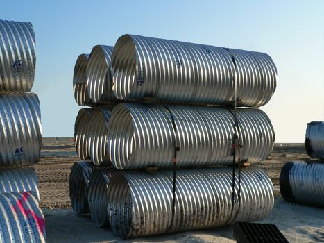 Stacked, corrugated pipes for construction project