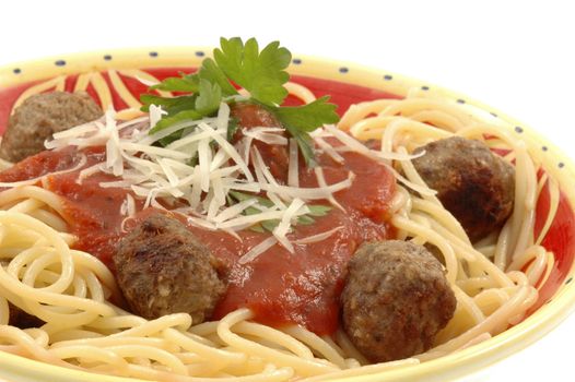Bowl of home-made spagetti and meatballs with tomato sauce.