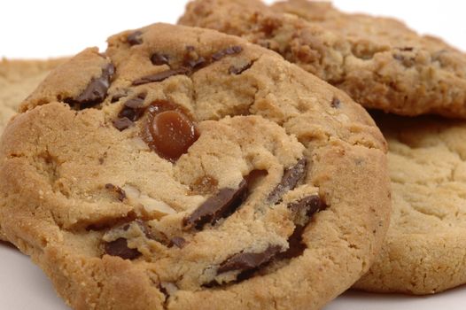 Assorted fresh baked cookies on a white background.