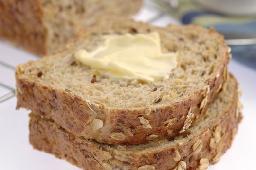 Slices of homemade whole grain bread closeup.